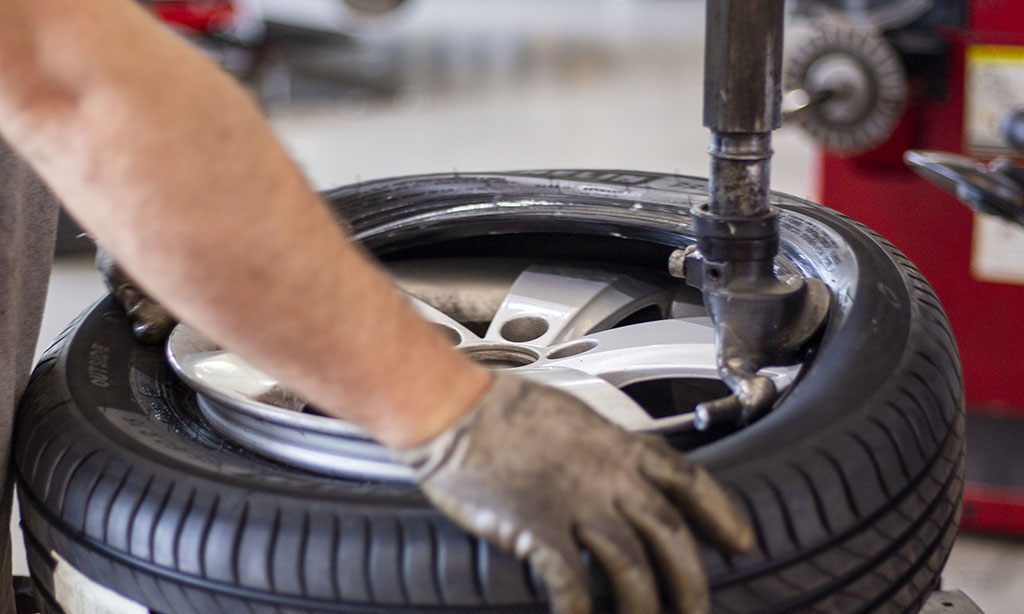 Man mounting a tire